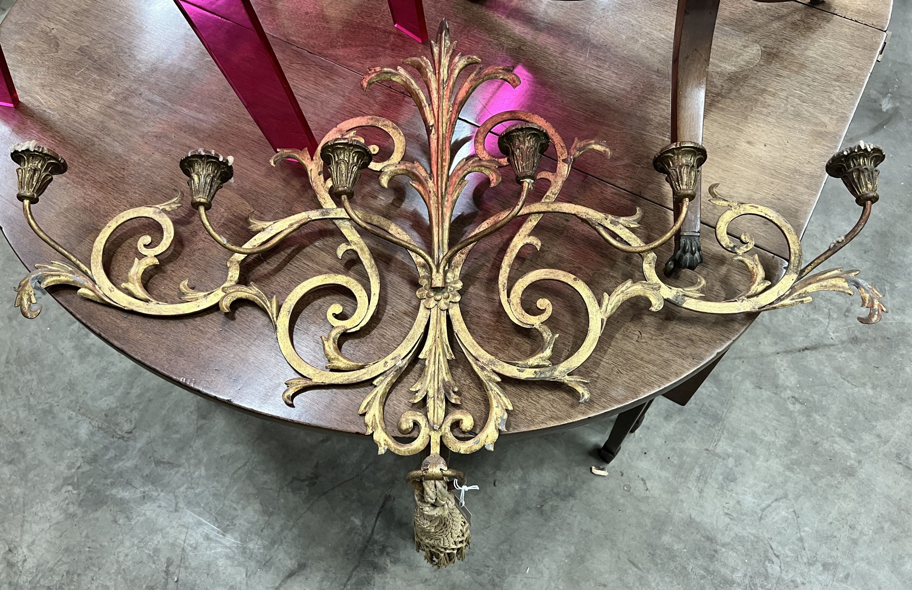 A painted scroll metal six branch wall sconce, width 100cm, height 66cm